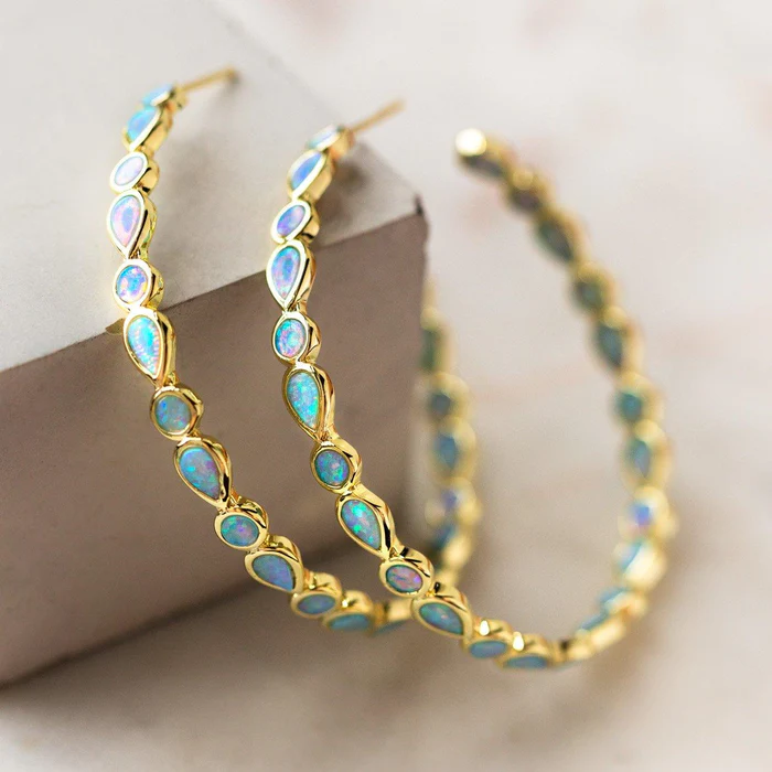 Earrings in a Golden Circle with Vintage Blue Opal